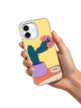 Hand holding A Cactus Borrows a Collar artwork on a transparent iPhone case