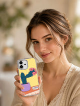 Lifestyle portrait holding A Cactus Borrows a Collar illustrated iPhone case