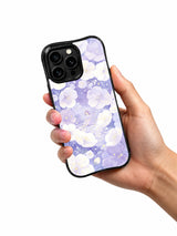 Celestial Bloom Shelter: A hand holding the illustrated case.