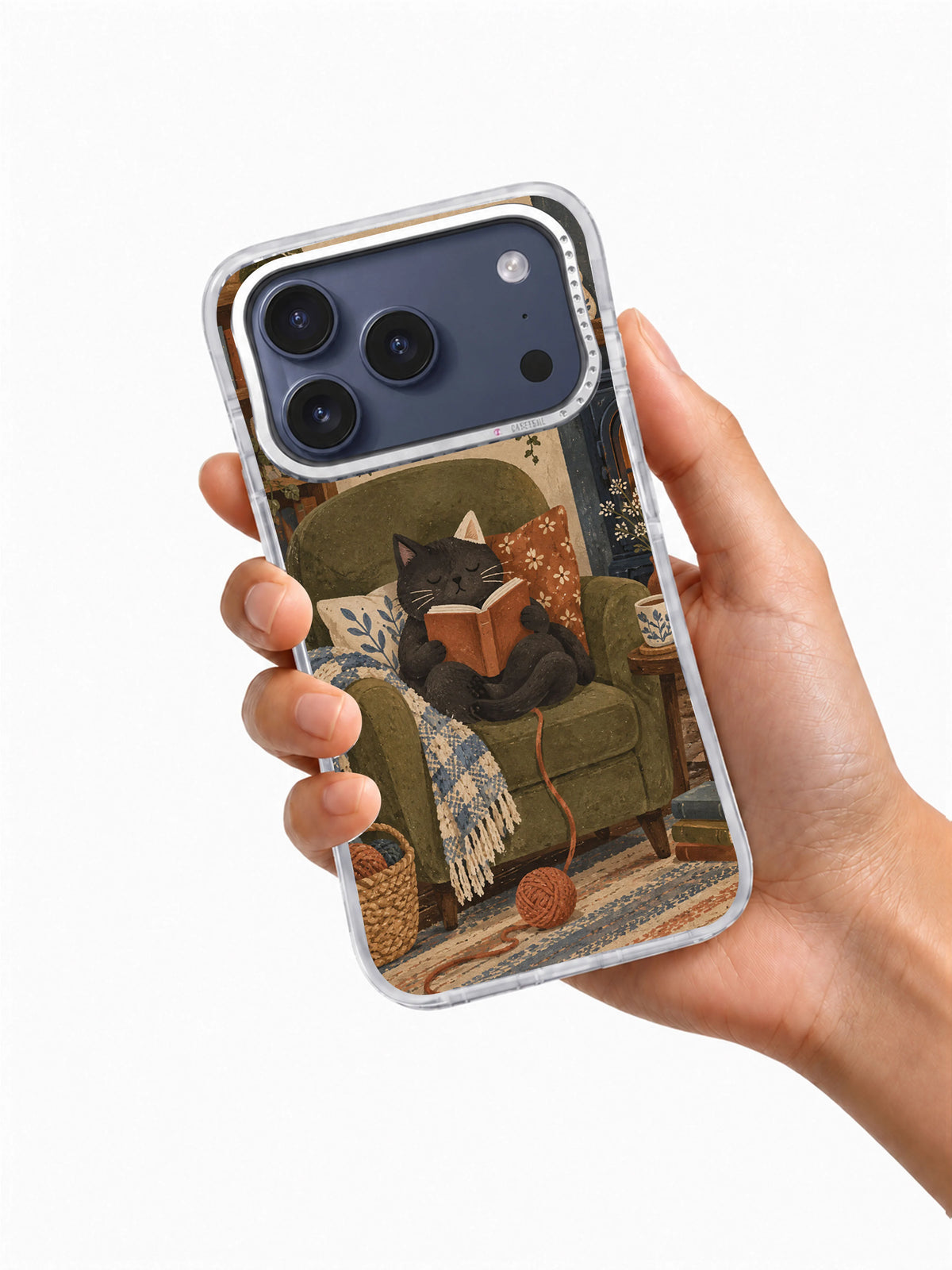 Hand holding The Chair That Purred transparent iPhone 17 Pro case