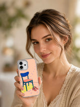 Lifestyle portrait showing A Chair Saves the Last Dance iPhone 17 case