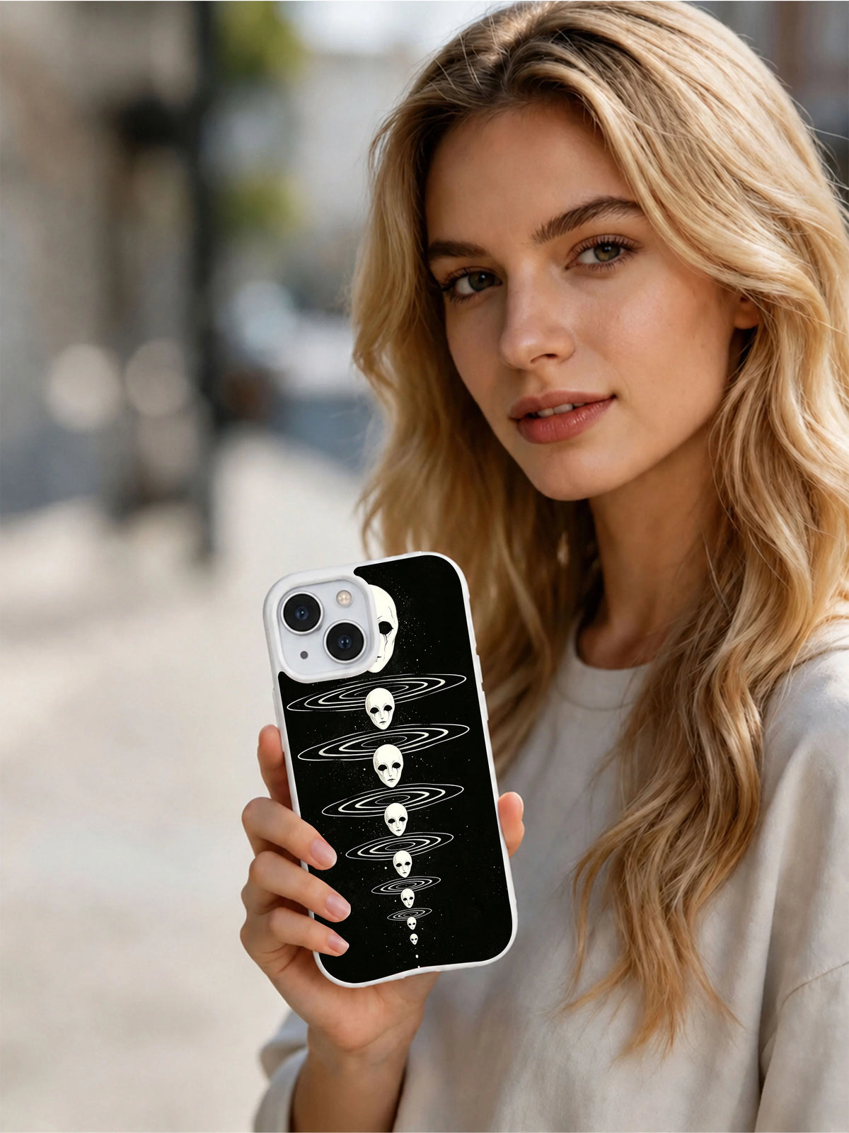 Person holding Vesper Wraith Chapel Bell Dreamfaces iPhone 15 Plus case