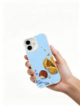 Hand holding a white iPhone 16 case with chestnut and mushroom artwork