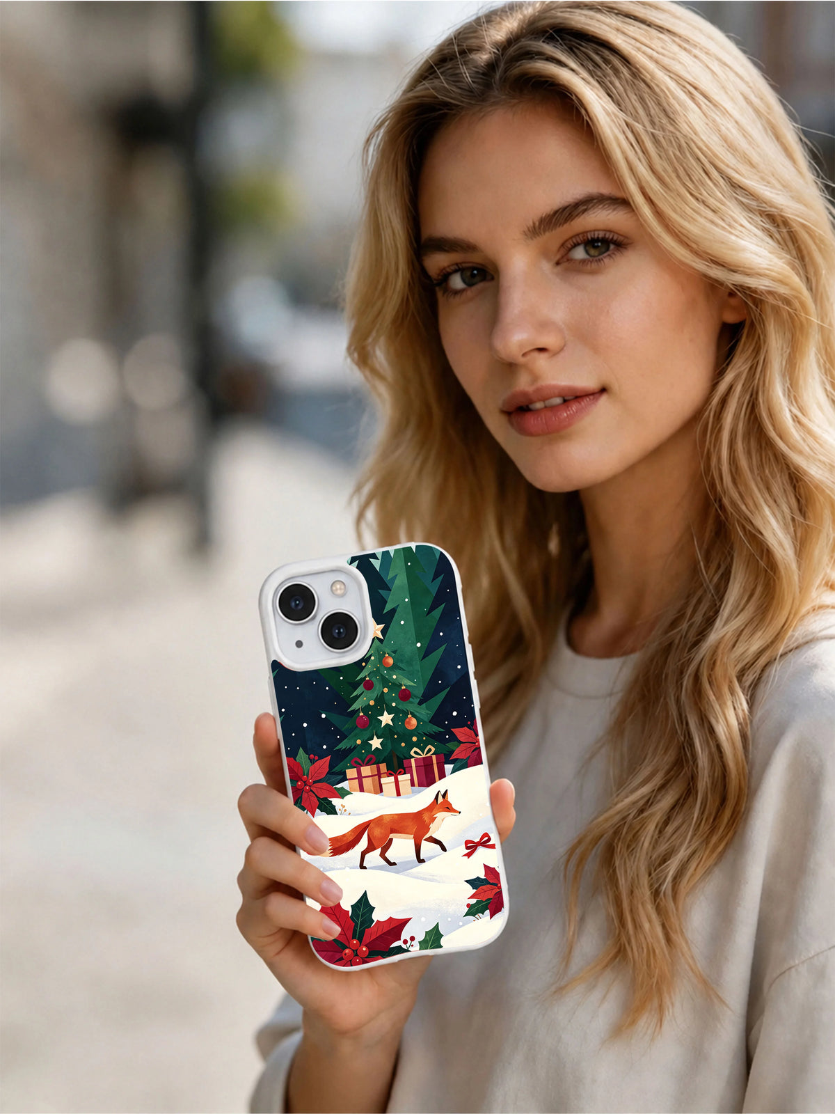 Person holding the Christmas Fox in the Holly Forest iPhone 14 case