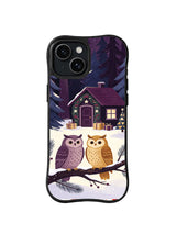 Black iPhone 14 case with two woodland owls, an ivory snowbank and a decorated forest library