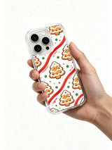 Christmas Sugar Picnic iPhone 13 Pro case held in hand