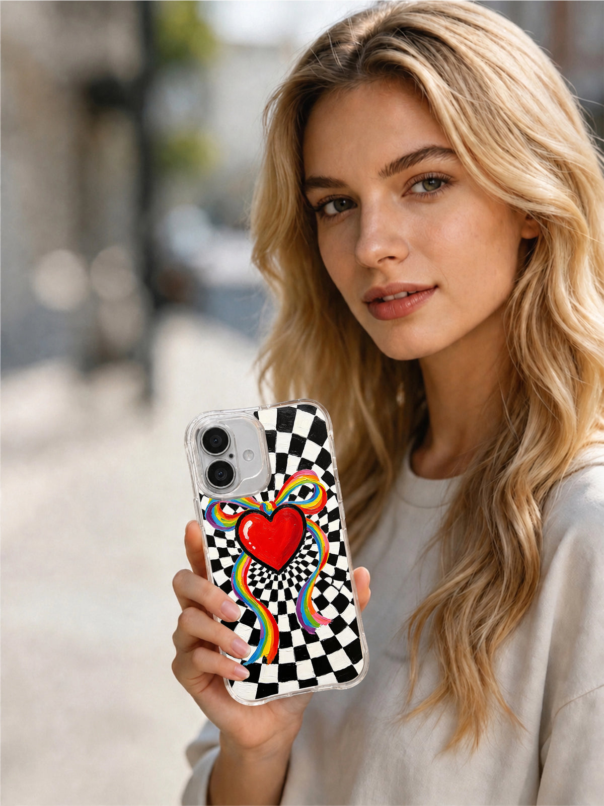 Ribbon Heart Tribute iPhone 16 Plus case in hand