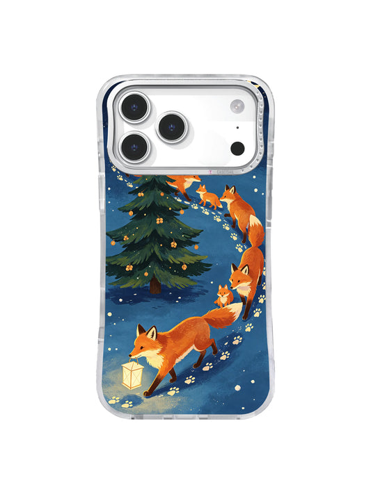 Copper foxes circle an evergreen tree through indigo snow on an iPhone 17 Pro case
