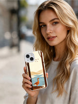 Person holding the Copper Geese Southbound white iPhone 13 case outdoors