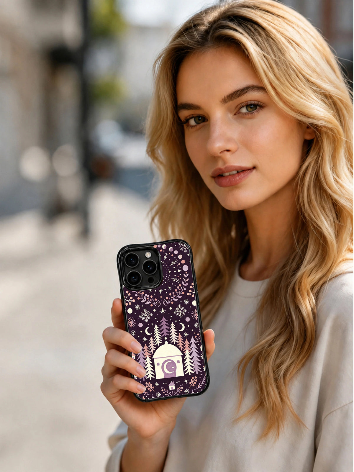Lifestyle view of a person holding the Pine Moon Snowstead iPhone 13 Pro case
