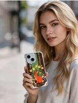Coral Rabbit Garden iPhone 13 case shown in an outdoor lifestyle scene