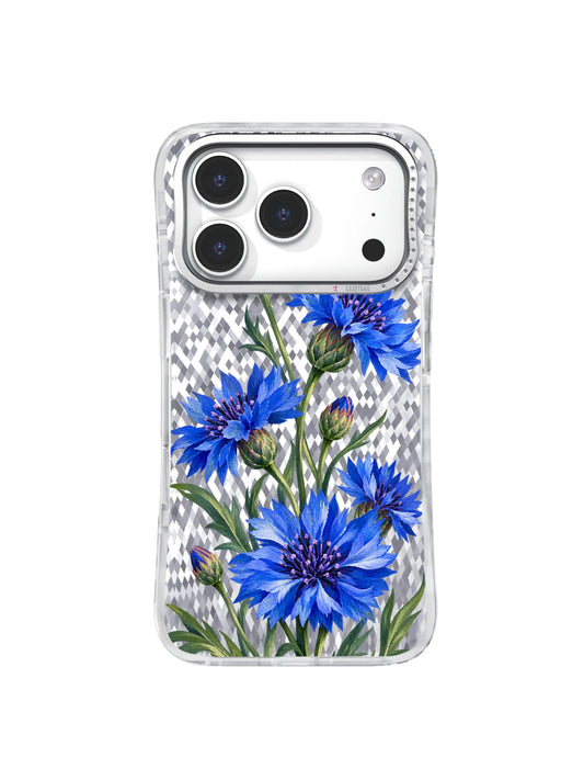 Cobalt blue cornflowers rise diagonally with sage leaves on a transparent iPhone 17 Pro case
