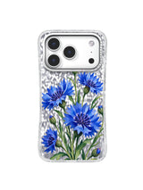 Layered blue cornflowers create a free zigzag path on a transparent iPhone 17 Pro case