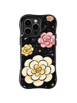 Orbit Bloom Constellation: Cream, pink and yellow layered flowers float among fine orbit lines and small stars on black.