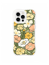 Hidden Cottage Garden: Cream, peach and yellow flowers conceal a tiny white cottage among green leaves.