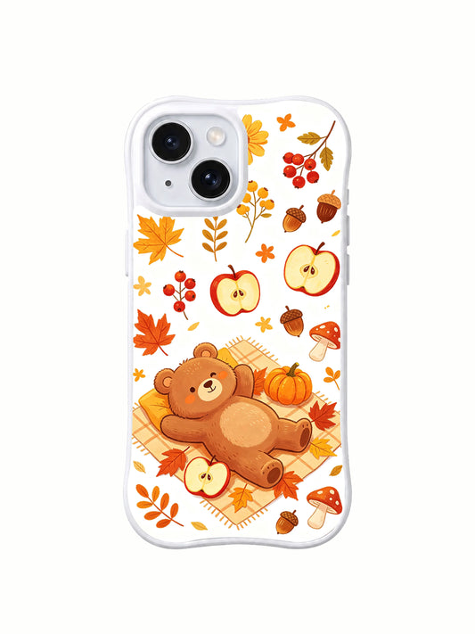 Cozy Bear Harvest Picnic: A reclining bear on a yellow checked blanket beneath sliced apples, with pumpkins and mushrooms around it.