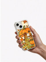 Cozy Pumpkin Cottage Animals iPhone 14 case in hand