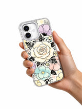 Cream floral art iPhone 17 case held in hand