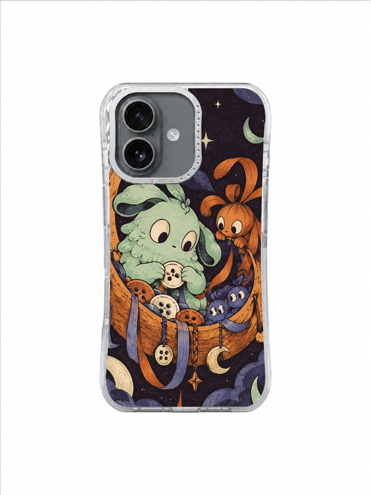 Mint creature sorting buttons inside a copper crescent basket on a black-plum iPhone 17 case