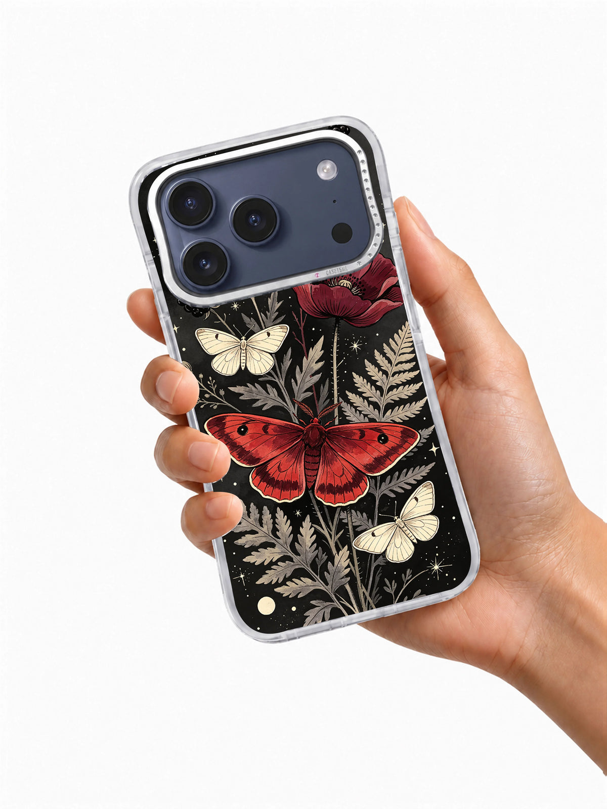 Hand holding a clear iPhone case printed with Crimson Moth Garden art