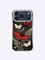 Crimson moth iPhone case pattern with ivory moths, burgundy poppies, sage ferns, and black background