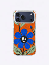 A Bloom with Crooked Teeth Ivory Eye Blossom artwork on iPhone 17 Pro Max case