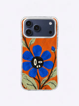 A Bloom with Crooked Teeth Open Garden Smile artwork on iPhone 17 Pro Max case