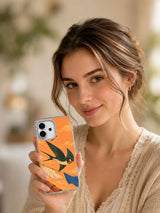 Lifestyle portrait holding the Crosswind Club swallow art iPhone 17 case