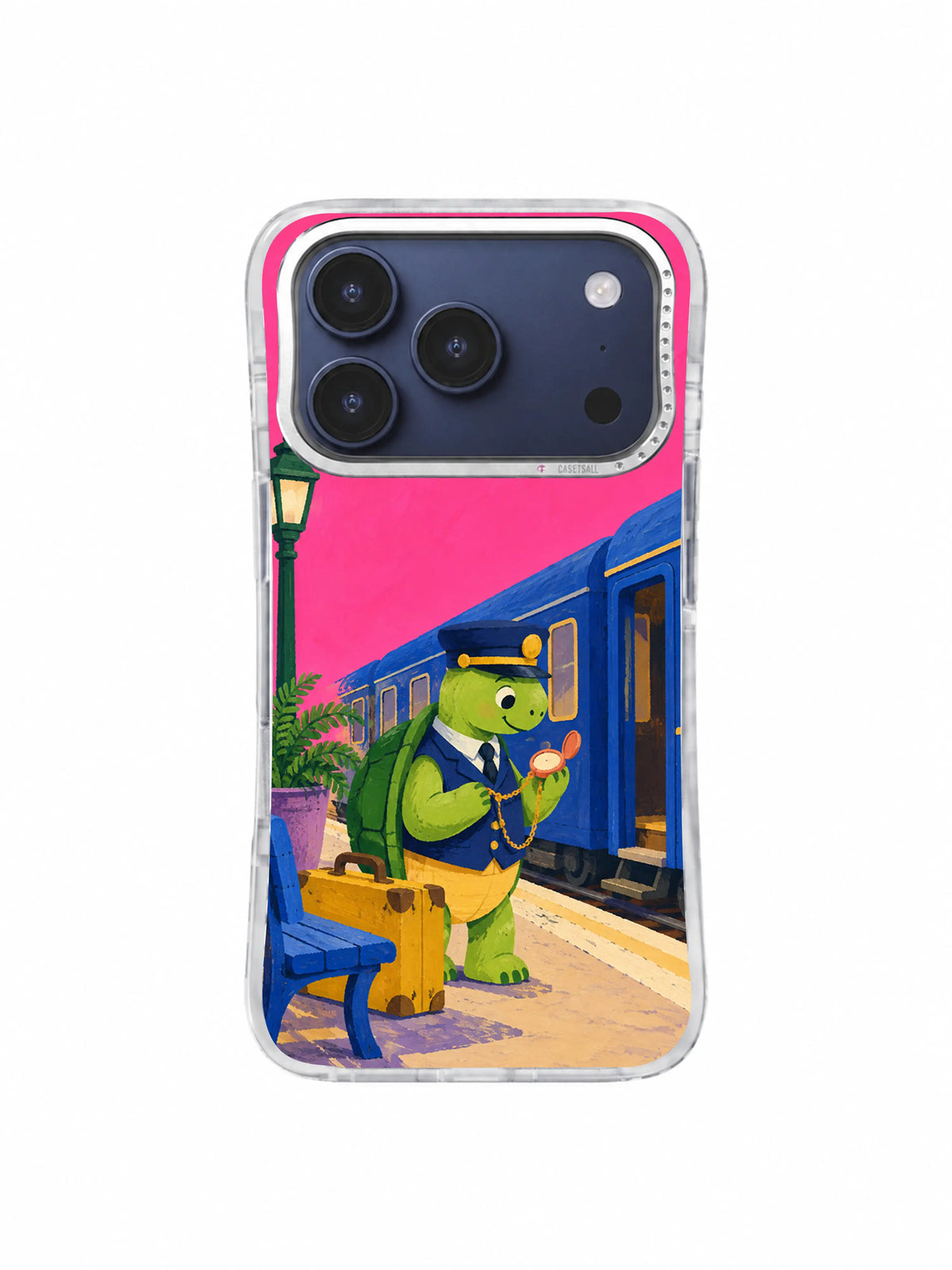 Turtle conductor steadying a violet fern beside a cobalt train on an iPhone 17 Pro case