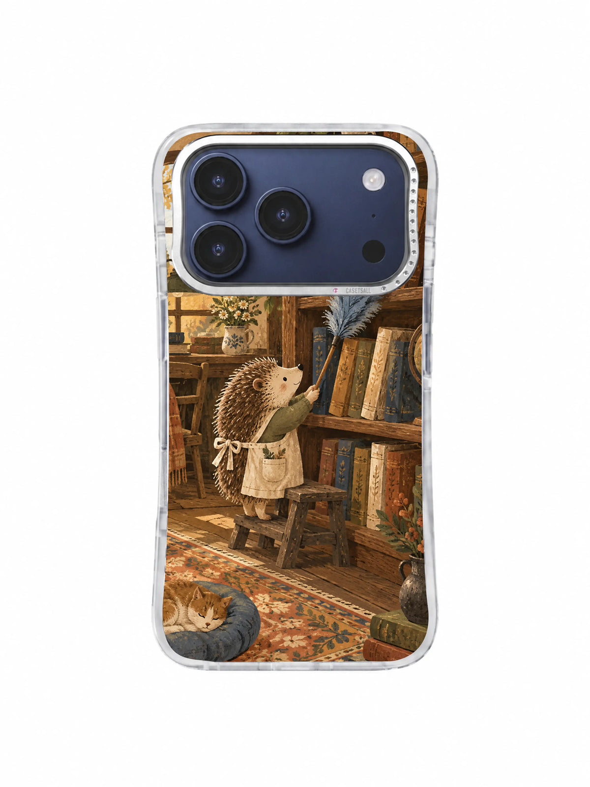 Aproned hedgehog librarian reaching toward books above a sleeping cat on an iPhone 17 Pro case