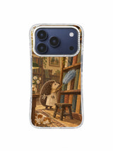 Hedgehog beside a wooden library ladder and leaning books on an iPhone 17 Pro case
