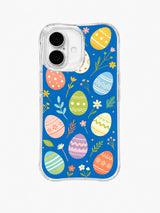 Easter Picnic Garden / Large Egg Picnic: Large pastel eggs with bold dots, zigzags and stripes, spaced between small leaves and blossoms on blue.