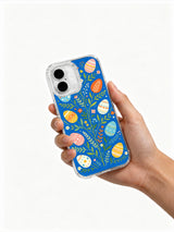 Easter Picnic Garden: Hand holding the case with its illustrated back facing outward.