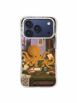 Ochre octopus carefully loosening blue thread at a dark olive worktable on an iPhone 17 Pro case