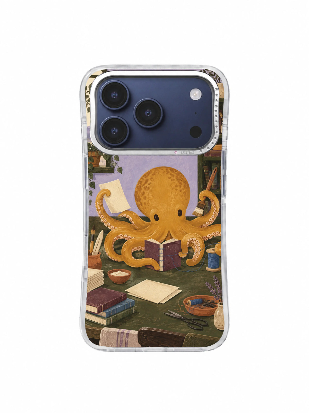Ochre octopus bookbinder arranging paper and tools on an iPhone 17 Pro case