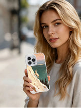 Morning Beyond the Cliff: Person holding the illustrated case in an outdoor portrait.