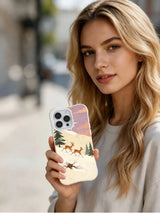 Reindeer Race: Person holding the illustrated case in an outdoor portrait.