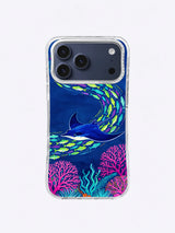 Manta Bloom Current case art with a cobalt manta ray, lime fish, and pink coral on deep blue
