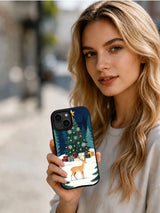 Person holding the evergreen Christmas finale reindeer iPhone 14 case