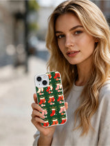 Person holding the Evergreen Stocking Rhythm Christmas iPhone 15 case