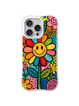 Rainbow Smile Bloom: Gülümseyen gökkuşağı yapraklı büyük çiçek küçük çiçeklerin arasında merkezi doldurur.