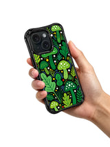 Green pop art forest iPhone 15 Pro case held in hand