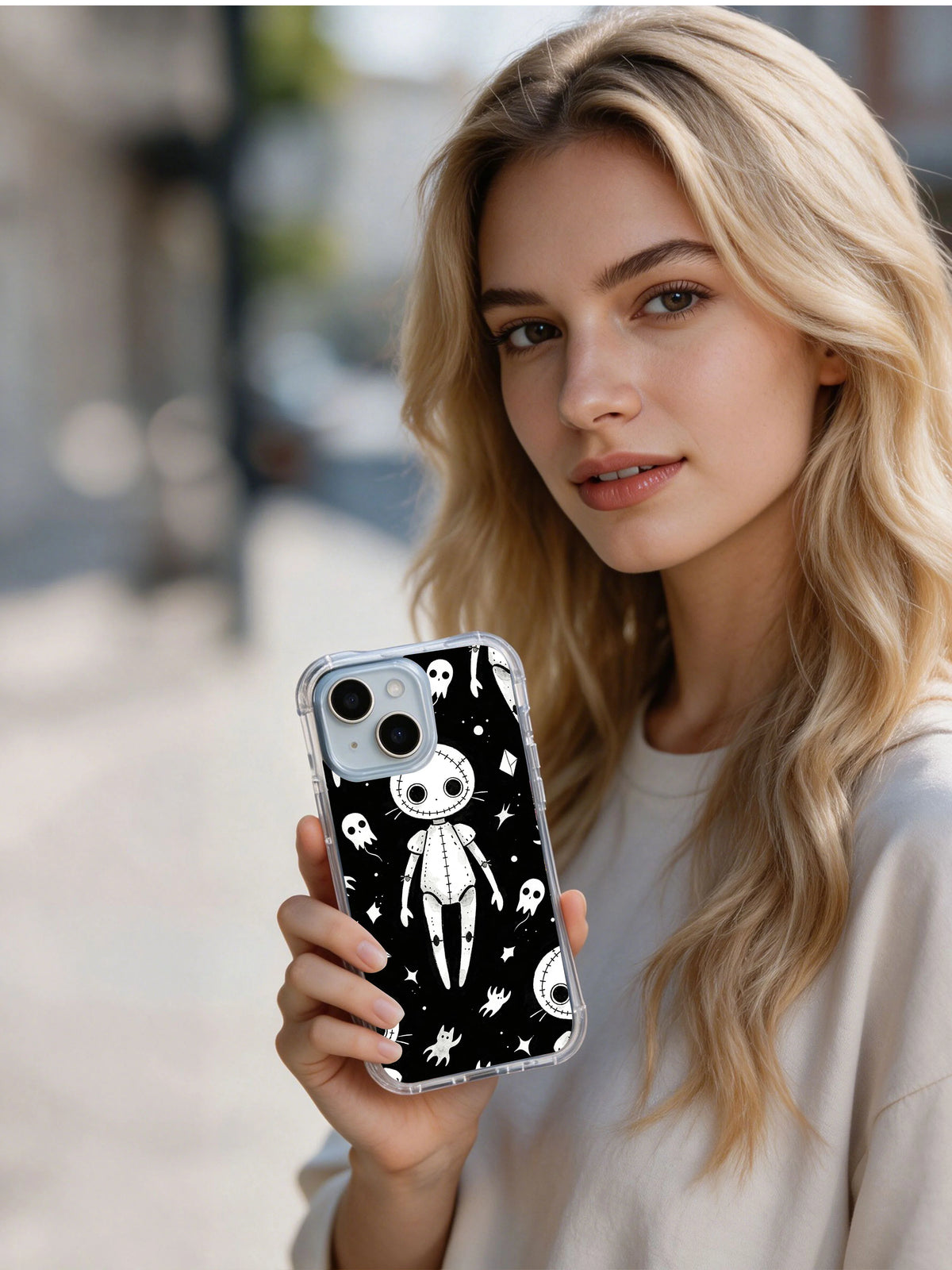 Person holding Vesper Wraith cute gothic creature iPhone 15 Plus case