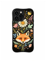 Fox Beneath Giant Daisy: An orange fox looks forward beneath a tall white daisy and floral stems.