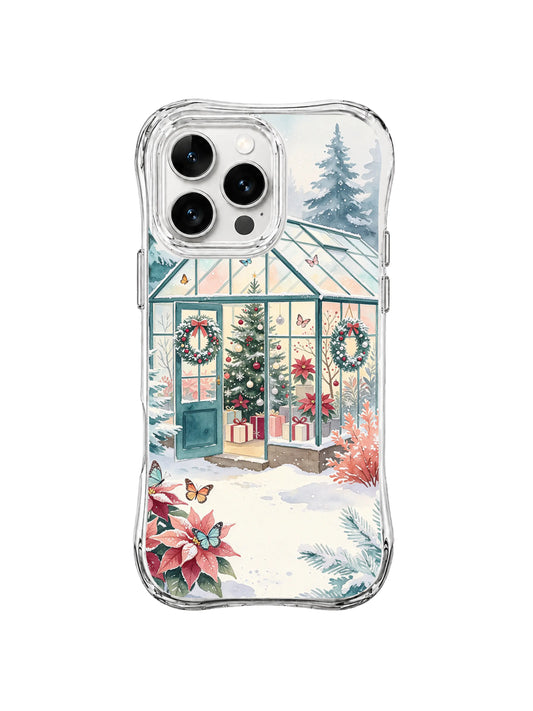 Frost Butterfly Conservatory iPhone 16 Pro case with a snowy glasshouse, wreath and evergreen