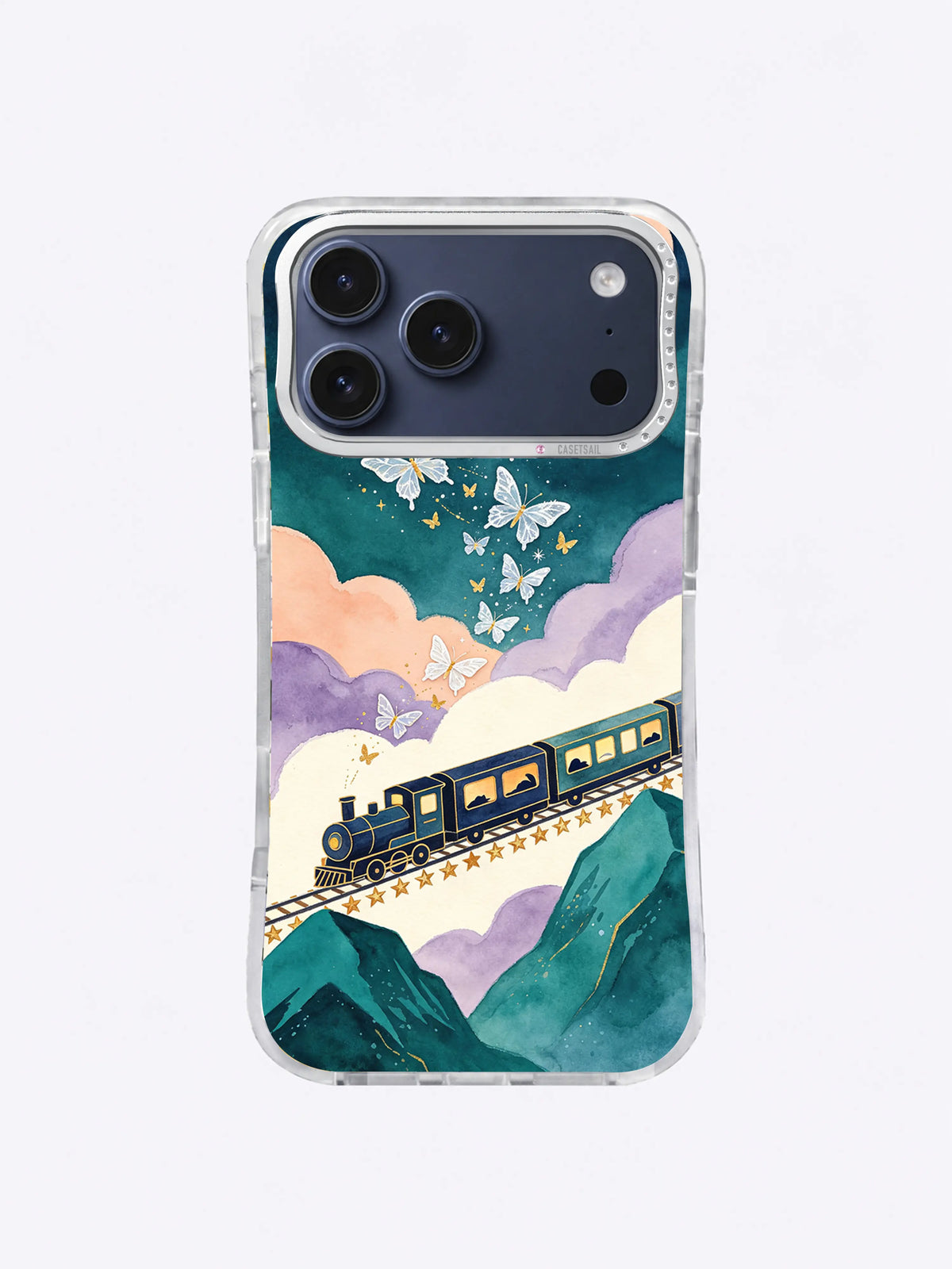 Lilac Cloud Departure iPhone case artwork with a navy locomotive, pale butterflies, peach clouds, and emerald mountains