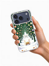 Frostwing Orchard iPhone 17 Pro Max case shown in hand with winter orchard illustration visible
