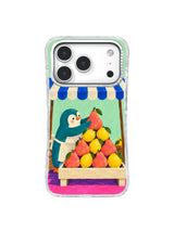 Teal penguin balancing the top pear of a colorful fruit pyramid on an iPhone 17 Pro case