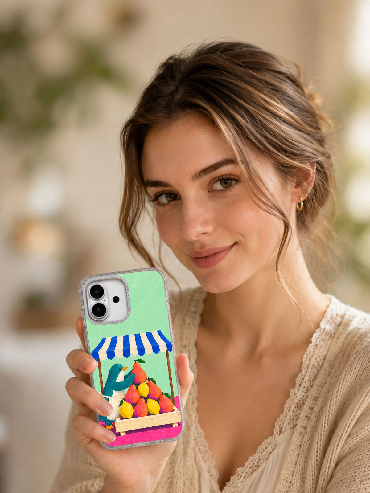Lifestyle view of The Fruit Pyramid artwork on a transparent iPhone 17 Pro case
