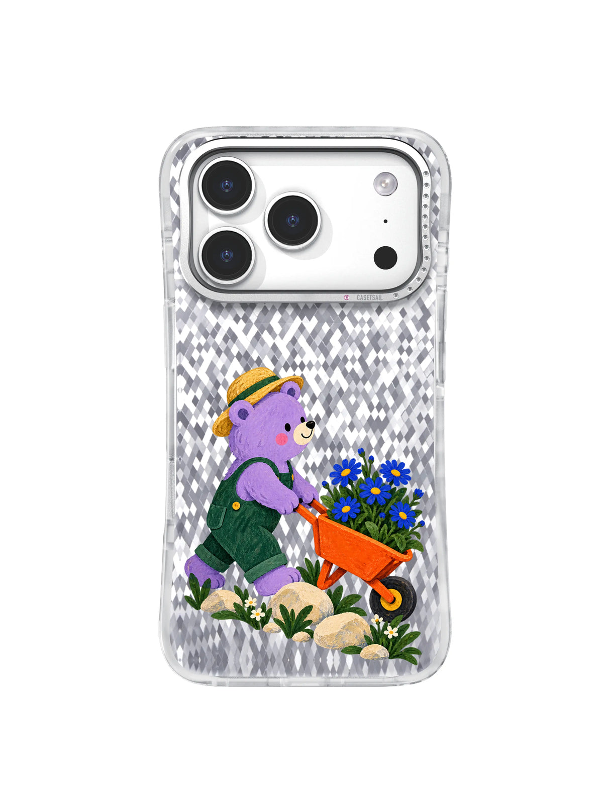 Lavender bear starting uphill with an orange wheelbarrow of cobalt daisies
